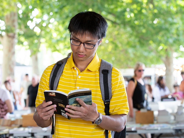 LSE student at the South Bank book stall